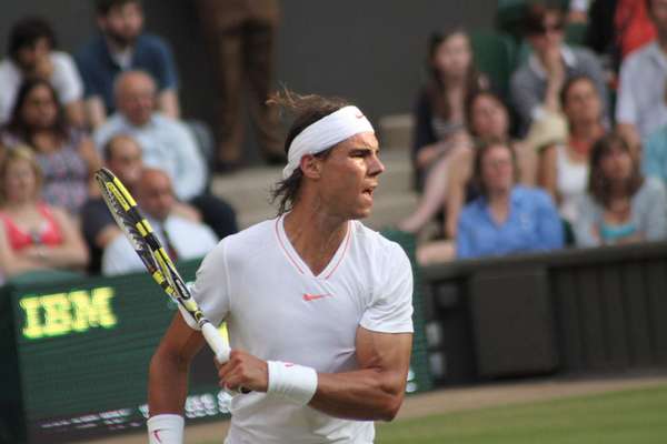 Rafael Nadal of Spain returns ball during second round match against Robin Haase of the Netherlands at Wimbledon in London, England on June 24, 2010