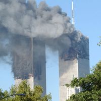 Clouds of smoke rise from fires at the World Trade Center Towers as a result of terrorist attack on September 11, 2001. Photographed 9:54 am in Lower Manhattan.
