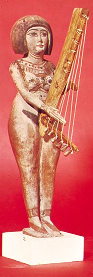 Egyptian statuette with angular harp